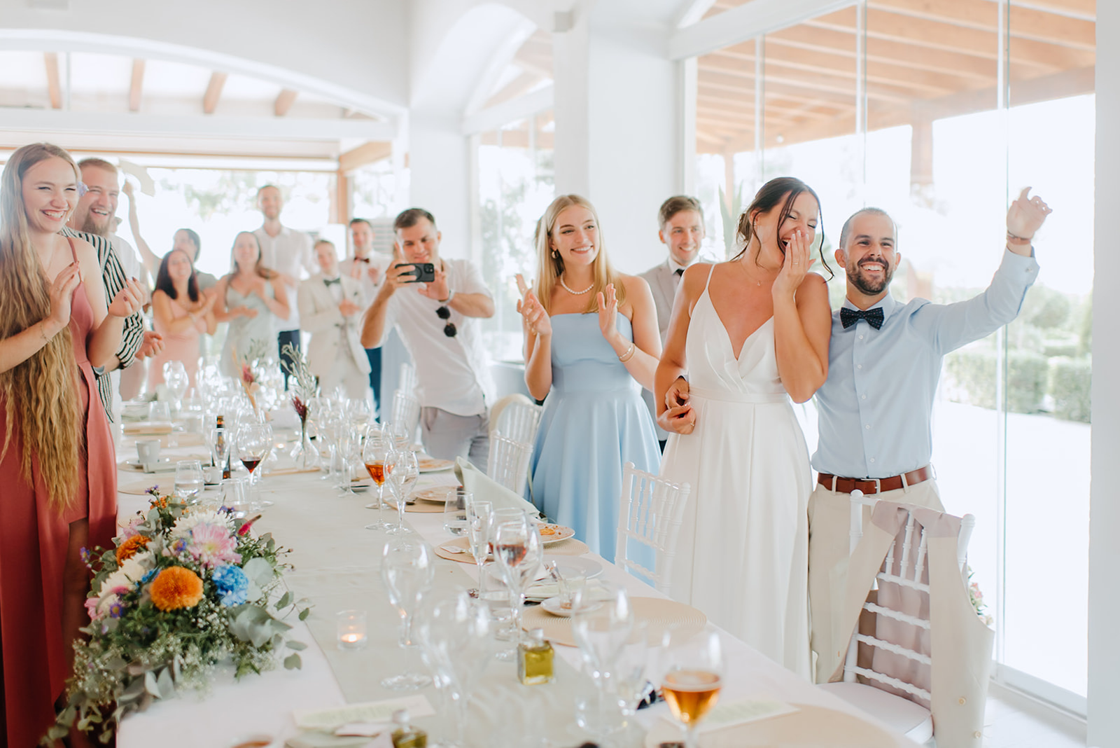 Castell de Barxell Wedding | A Romantic Spanish Countryside Celebration with Zuzanna + Raul – Zuzanna and Raul entering the reception to loud cheers.