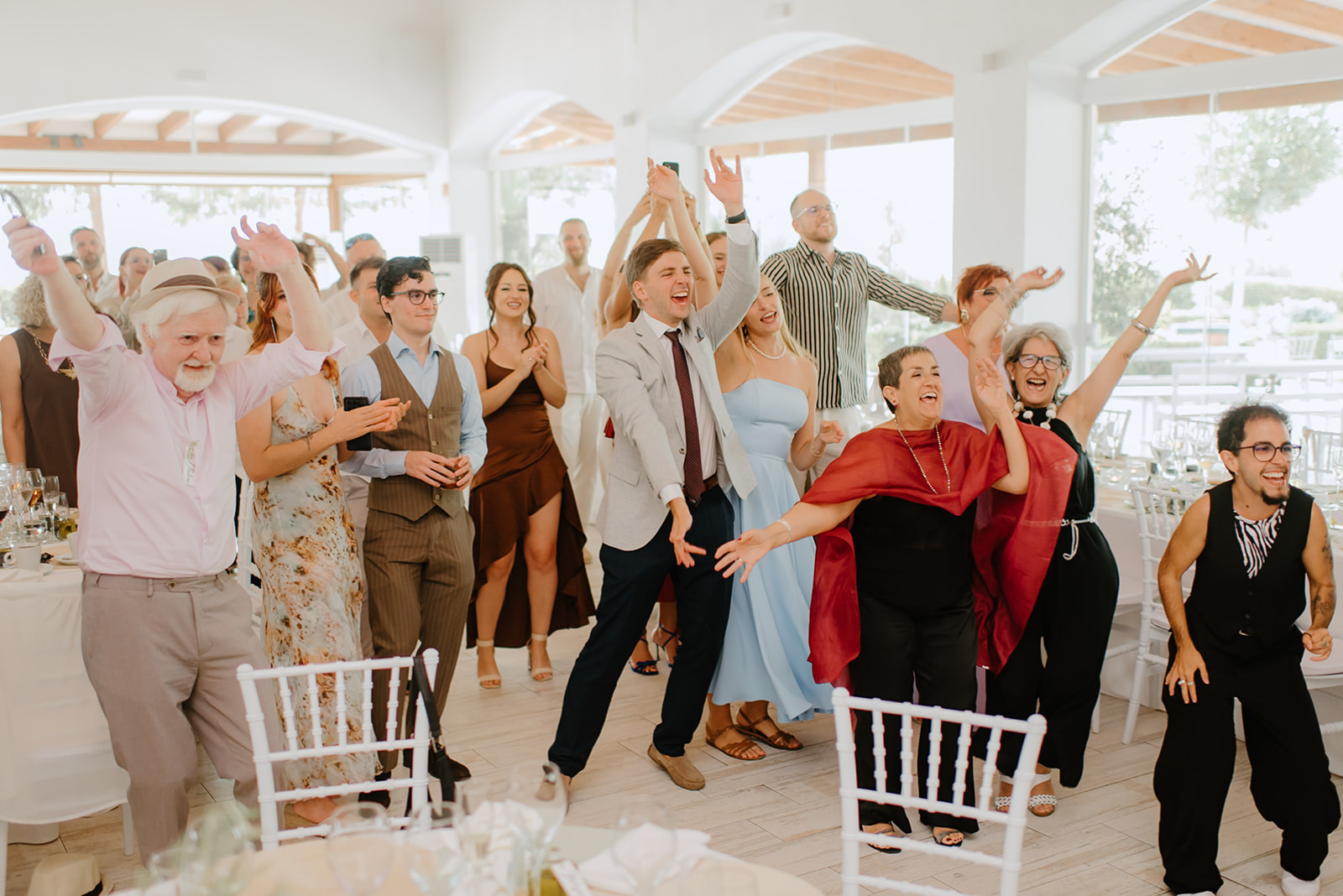 Castell de Barxell Wedding | A Romantic Spanish Countryside Celebration with Zuzanna + Raul – Guests forming a circle around the couple during a Polish folk dance.