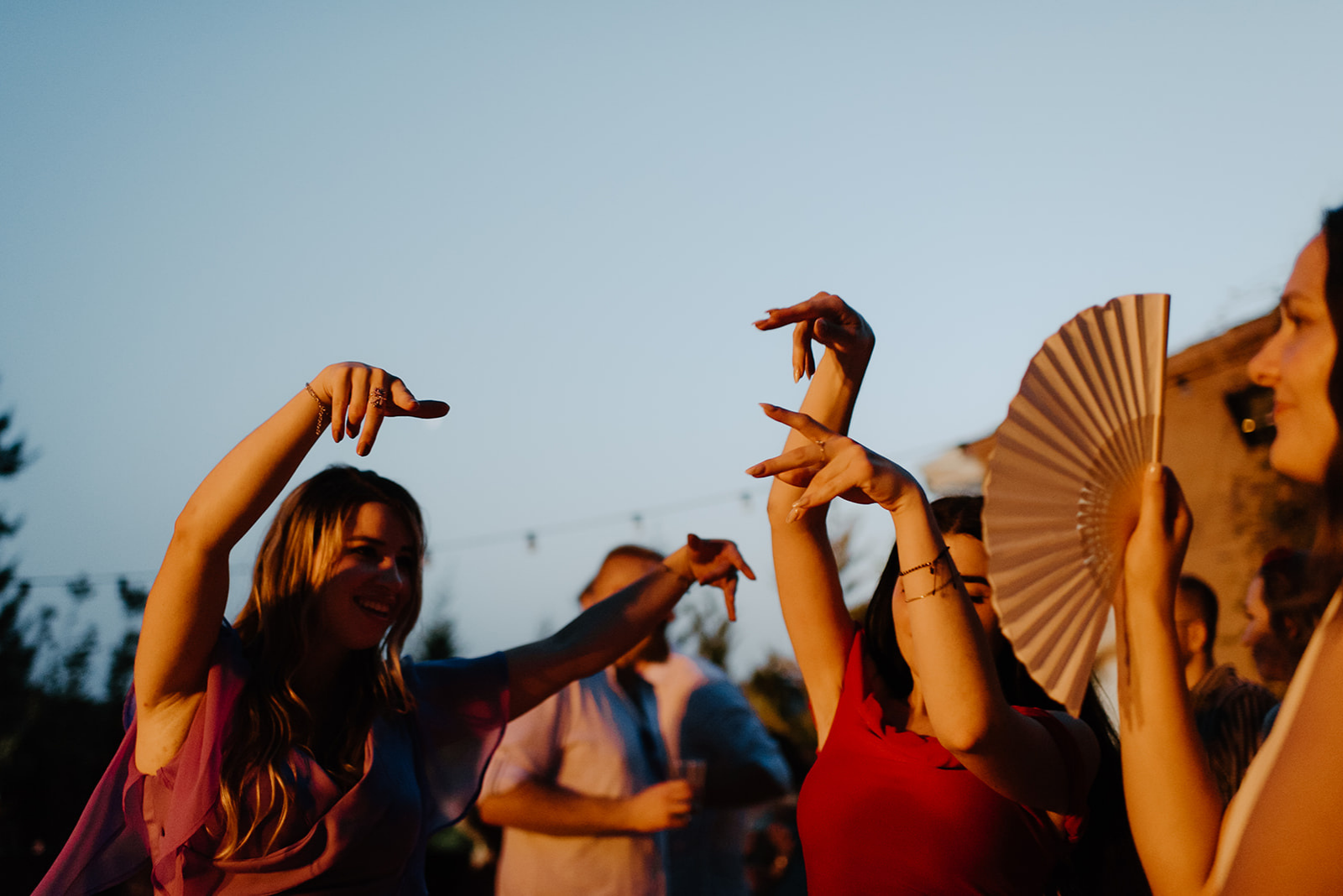 Castell de Barxell Wedding | A Romantic Spanish Countryside Celebration with Zuzanna + Raul – A wide shot of guests dancing under the stars.