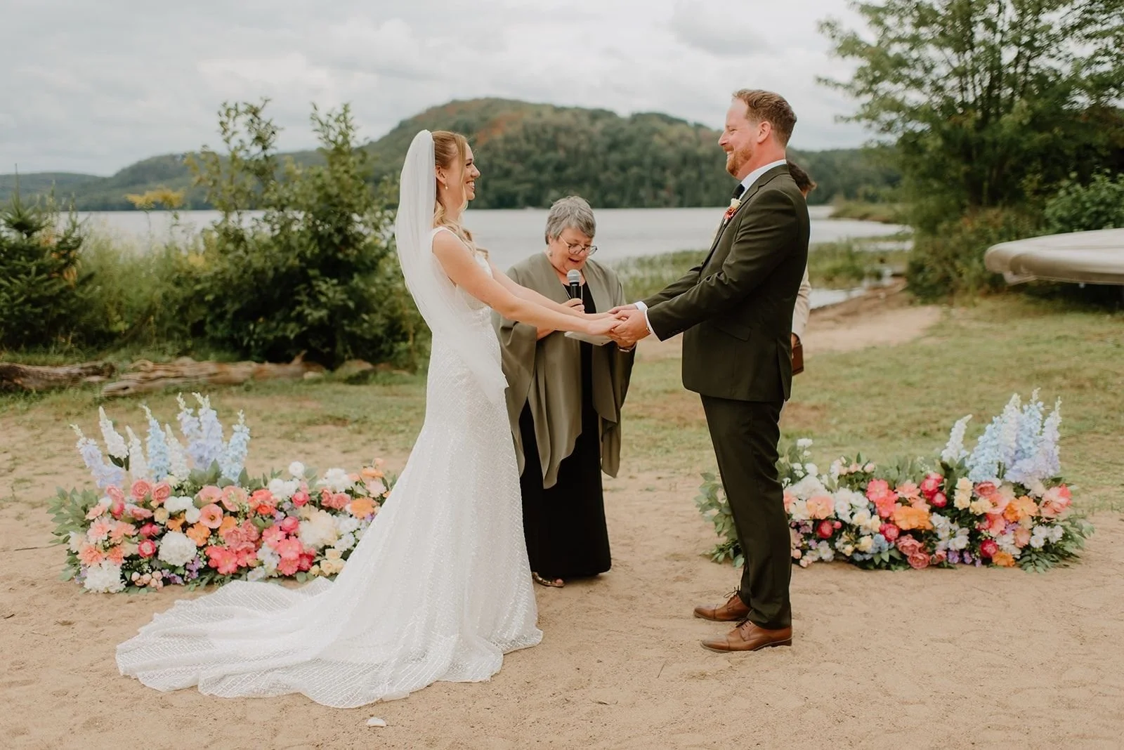 Camp Eden Woods Wedding in Ontario | Amy + Rory – Close-up of Amy and Rory exchanging heartfelt wedding vows.