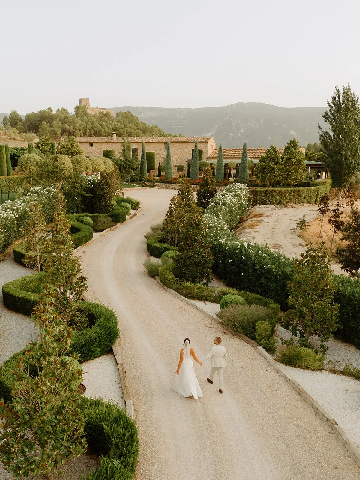 Bride and groom sharing an intimate moment during their destination wedding in Spain, photographed by Sara Monika