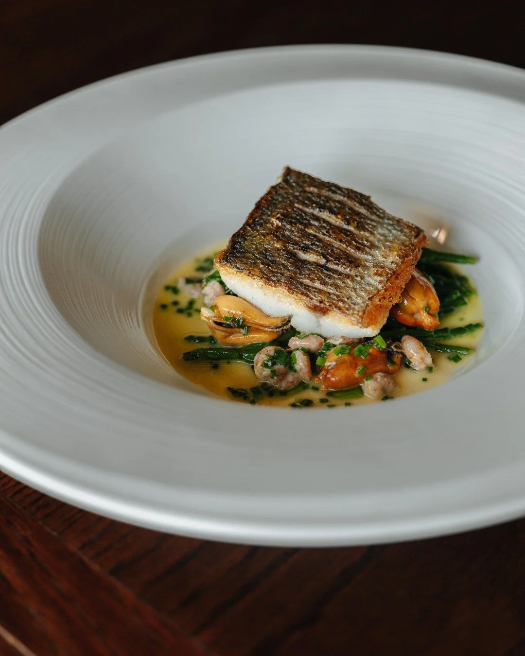 Pan Fried Sea Bass, Brancaster Mussel Broth, Samphire, Brown Shrimp.

View our sample Menus
https://www.theinghamswan.co.uk/ourmenus