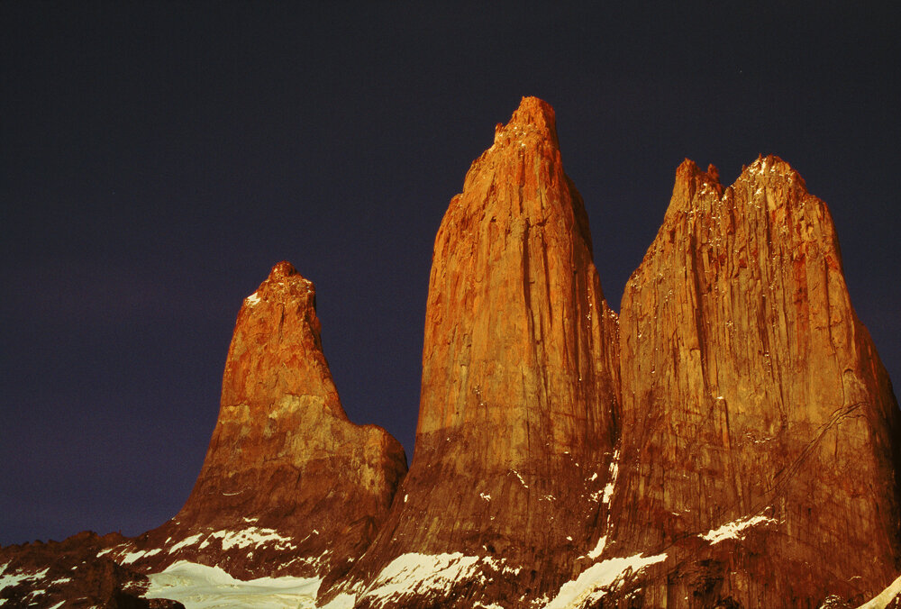 Dramatic rock formations jut out of the snowy landscape in Torres del Paine, Chile. Photo: Kurt Deutmeyer