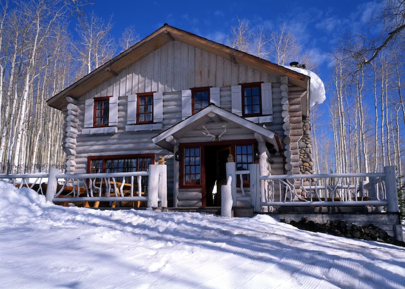 Trappers Cabin surrounded by snow during winter in Beaver Creek