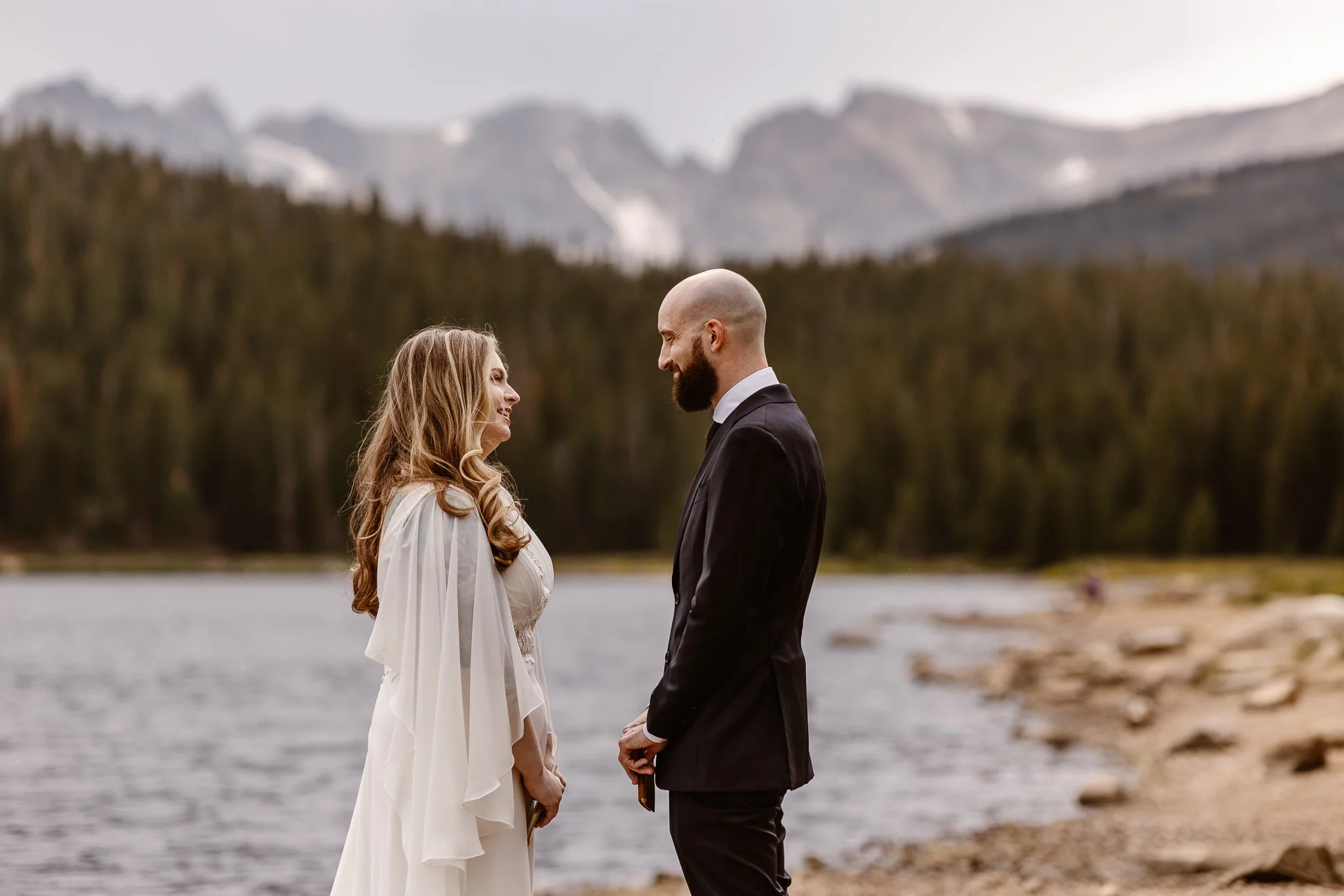 Both holding their vow books closed, the couple share sweet, unprompted words to each other.