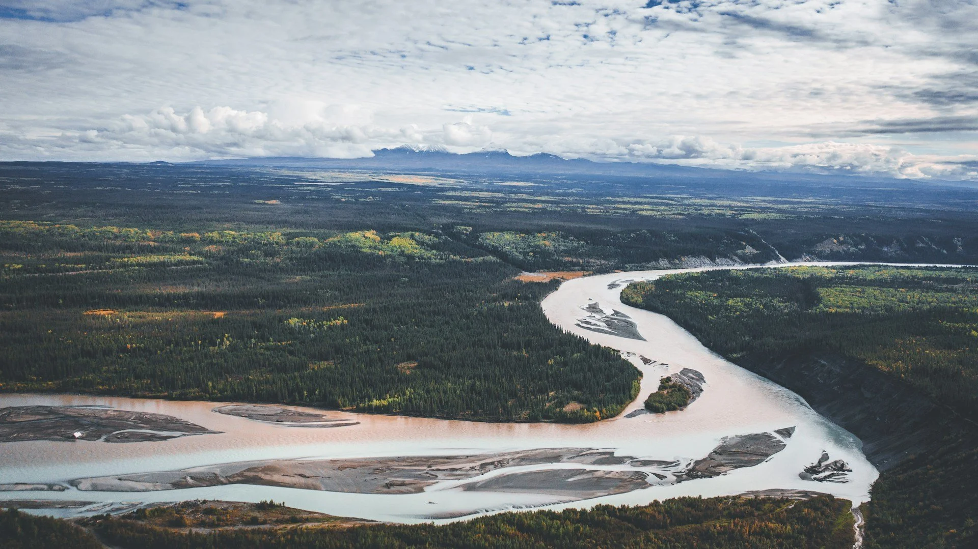 A birds-eye-view of the meandering river at Wrangell St. Elias National Park and Preserve. It is a perfect image to describe the path and impact of a moving glacier.