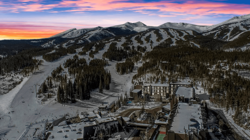 As the sunset turns the sky bright hues of orange, purple, pink, and blue, the mountains and sprawling estate of Beaver Run Resort are already in the dark. You can see the ski paths that flow down the mountains, a true ski-in and ski-out resort.