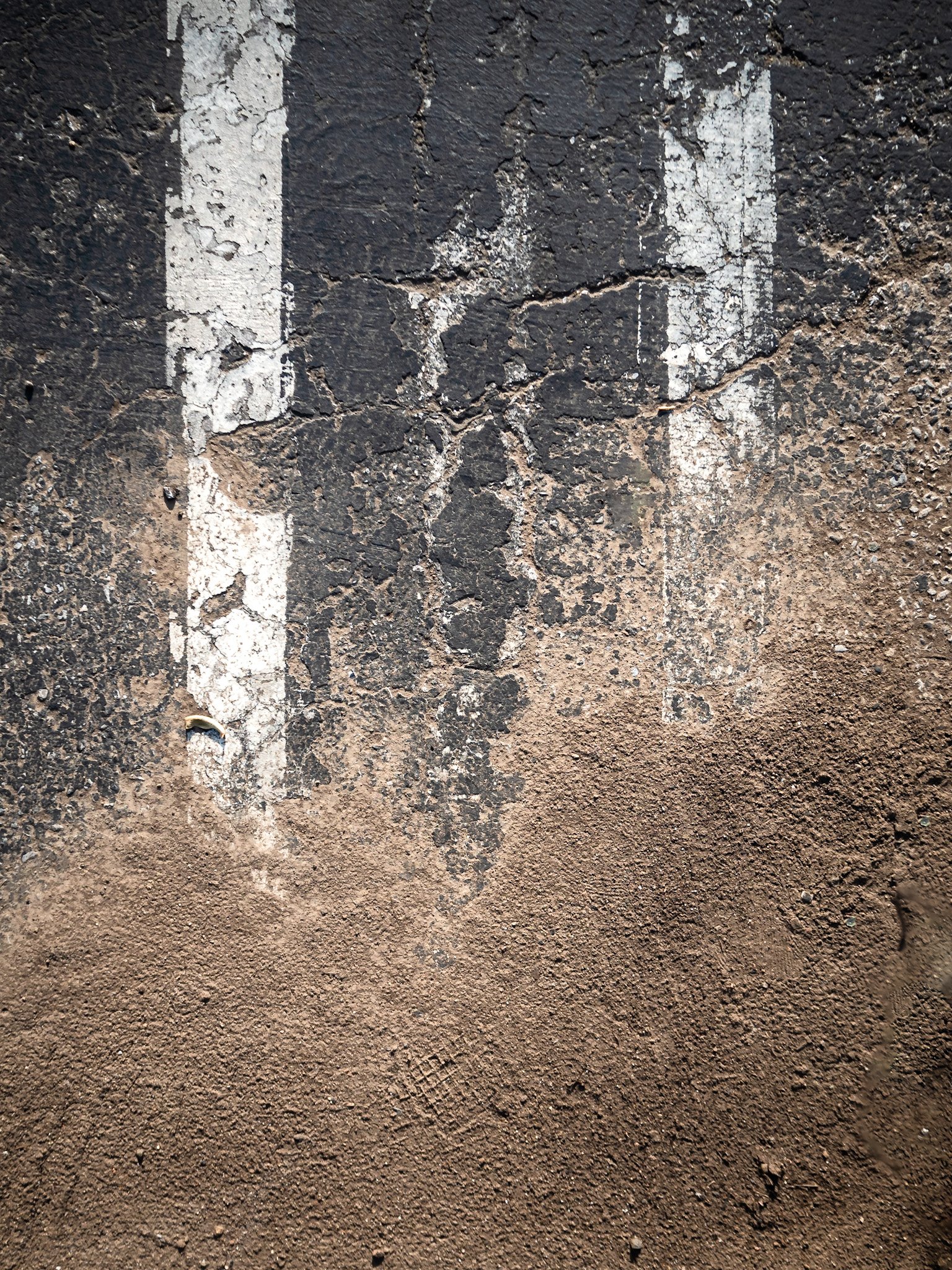 Composition with Verticals, Tarmac, and Dirt