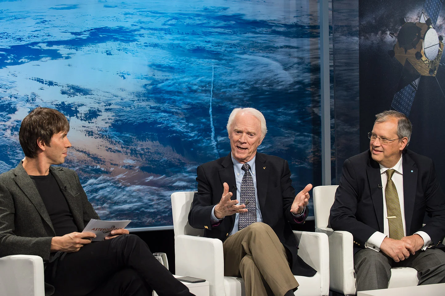 Brian Cox, me, Dorin Prunariu (left to right) on one of the panels during the 2017 live world-wide broadcast of Asteroid Day (UN recognized day of worldwide education re asteroids).