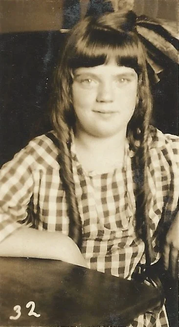 My mother... when she was a cutie in long curls!
