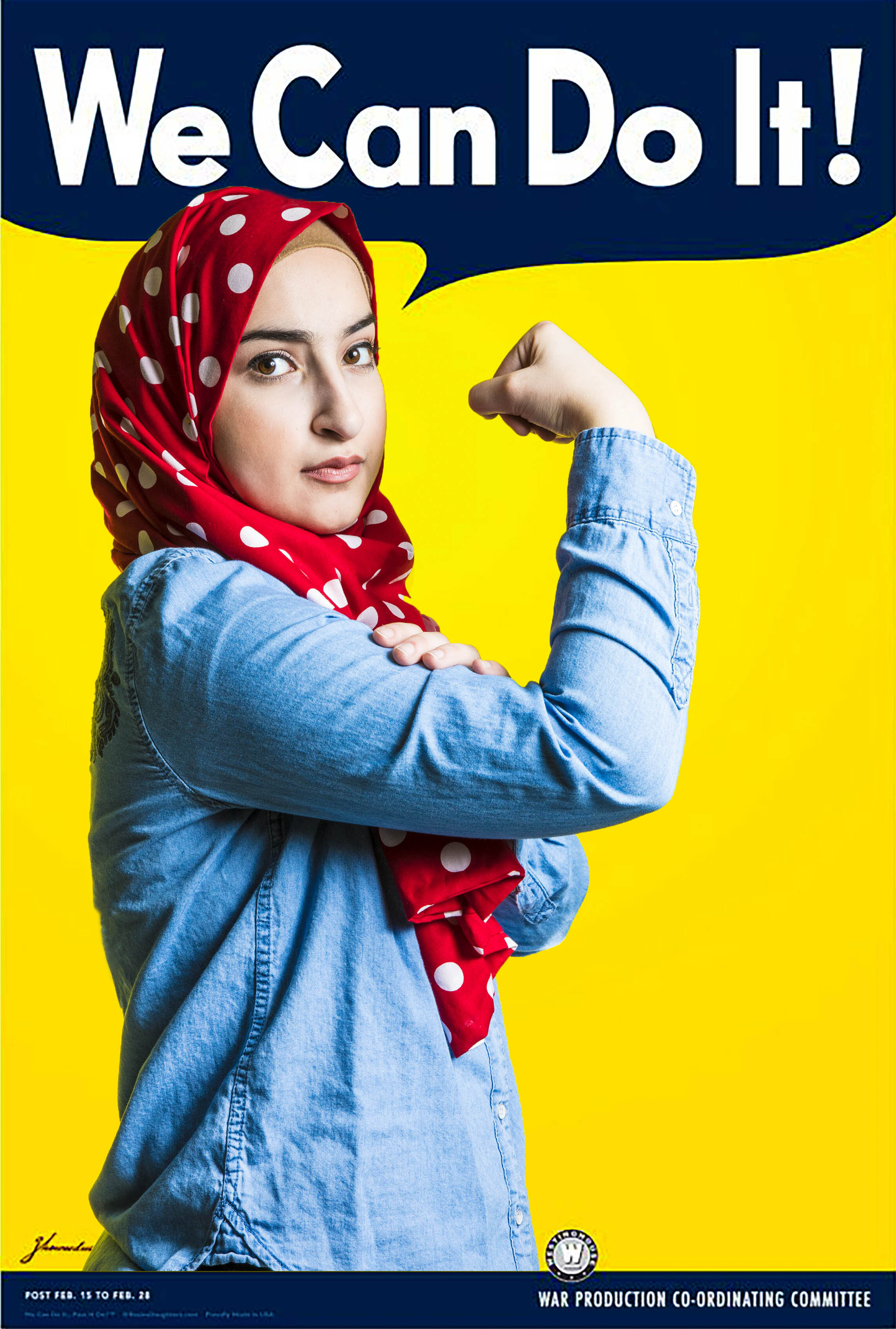 A woman dressed as Rosie the Riveter wearing a hijab. 