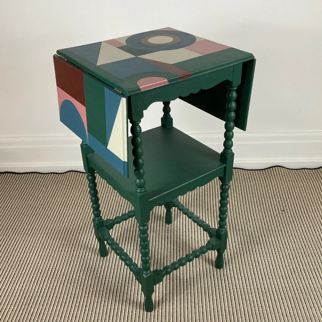 I loved the process of designing and creating the geometric pattern on this table transformation.

My client inherited the piece and wasn't a fan of the dark wood finish. She visited the workshop and we discussed the kind of patterns and colour combi