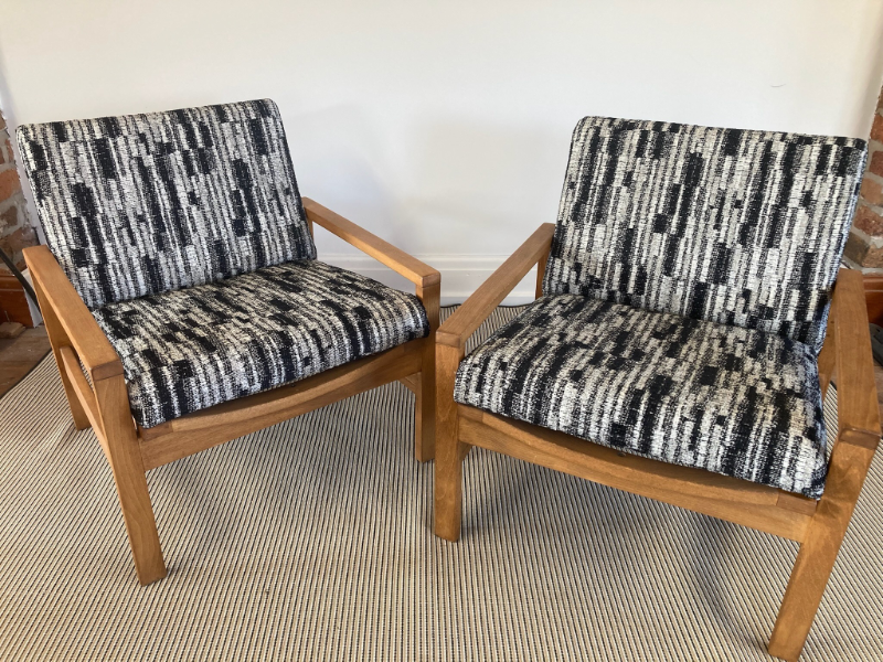 A pair of reupholstered lounge chairs in a black, grey and white printed fabric - client commission by The Odd Thing