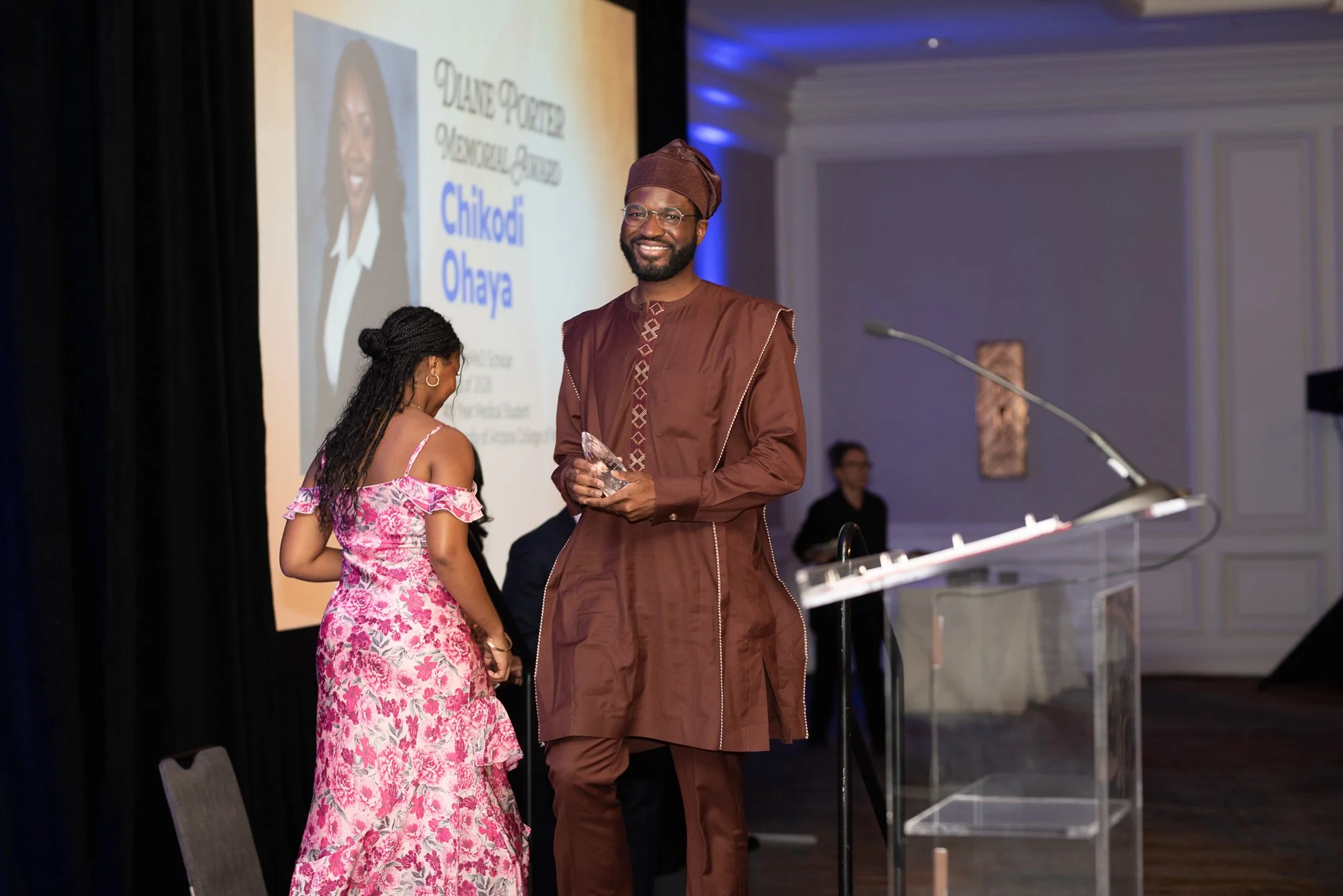 Ewoma Ogbaudu reads acceptance speech for Chikodi Ohaya's 2025 ElevateMeD Diane Porter Memorial Award