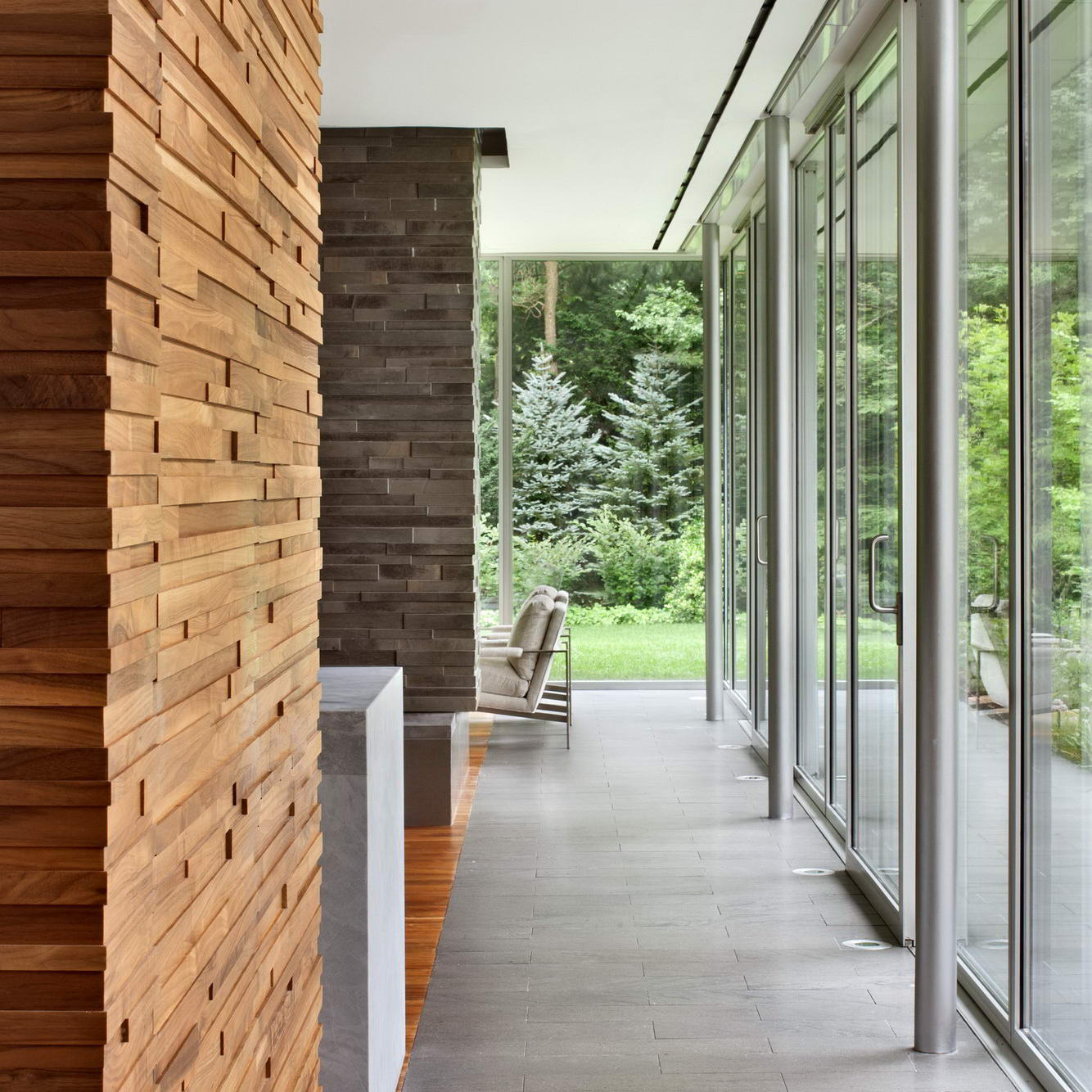 The use of the same Italian Basalt flooring inside and outside furthers the feeling that, like the indoors, the outdoors is living space as well.