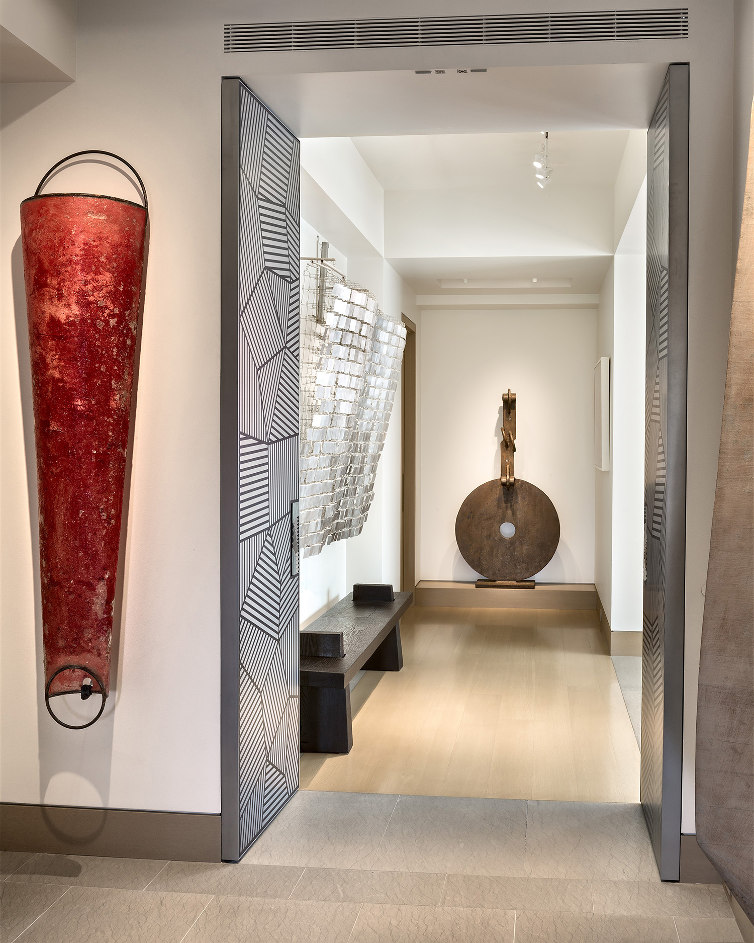 Warm, luxurious materials used in understated ways provide a clean and neutral setting for the art to live comfortably in.