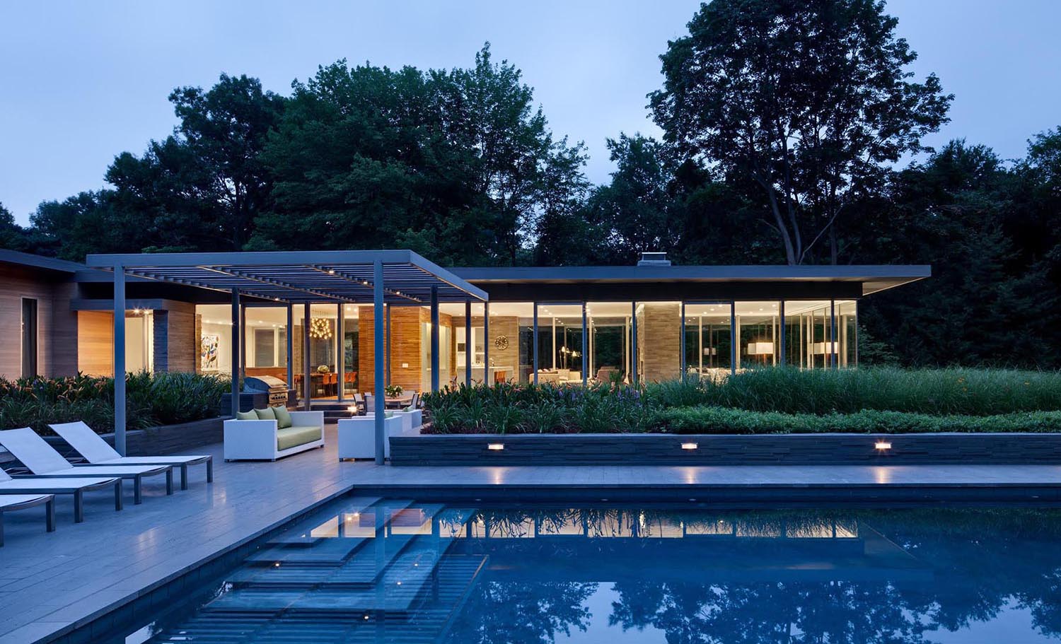 Outdoor “living rooms” were designed for cooking, dining and entertaining, and were lit and equipped for both day and night use..