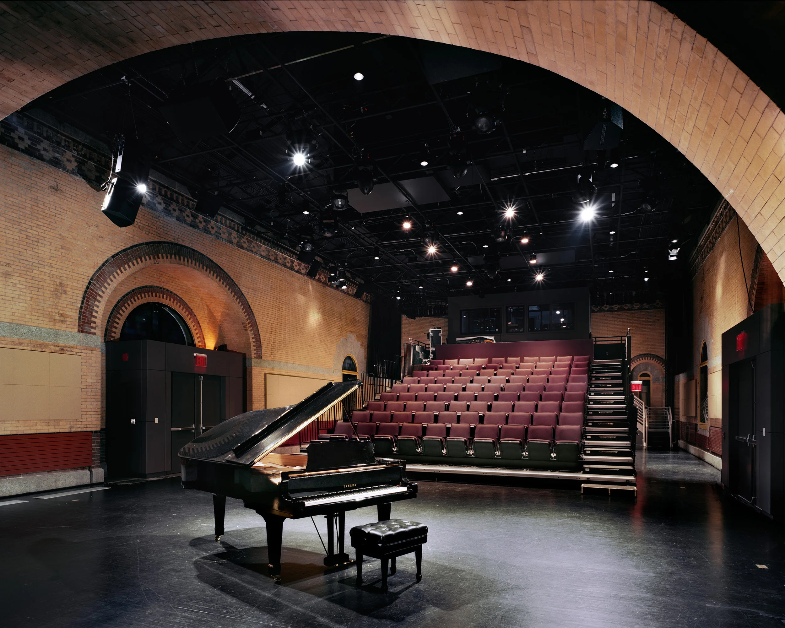 Starting with an abandoned, historic waterworks building from the 1890’s, we collaborated closely with this Harlem performing arts group to envision a new facility that includes a black box theater, changing and green rooms, offices and storage. Moving from shared facilities into a new dedicated home was a big change for Harlem Stage and we spent a great deal of time exploring and planning how they could most effectively use their new spaces. Many options for the black box theater were considered in order to arrive at the best set of stage and seating arrangements. Adding onto the existing structure was necessary to provide storage space in close proximity to the performance space. A new, much more accessible entry at a lower street level makes a gracious arrival sequence and allows good circulation down to coat rooms and restrooms and up to the performance space above.