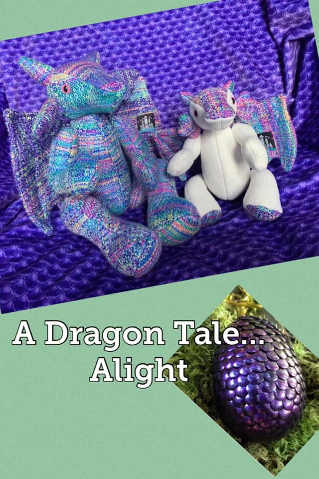Photo ID: the words “A dragon tale…alight are writers in white over a green background with a purple scaled dragon egg, above is a photo of two wrap scrap dragons on a purple blanket