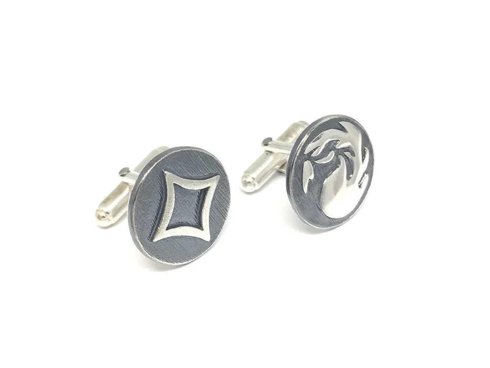 Pair of colourless and red Mana cufflinks in silver