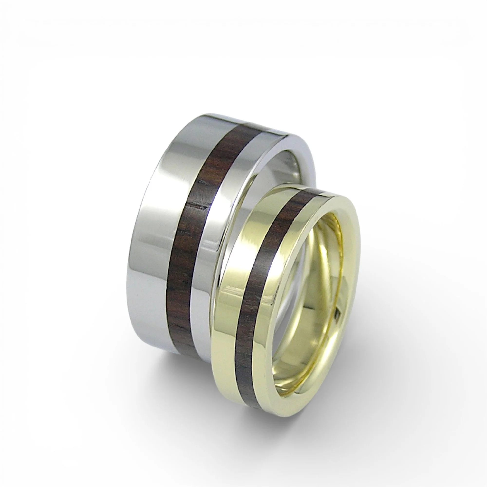 18karat white gold ring and 18karat yellow gold ring pair with cocobolo wood inlay off centre.jpg