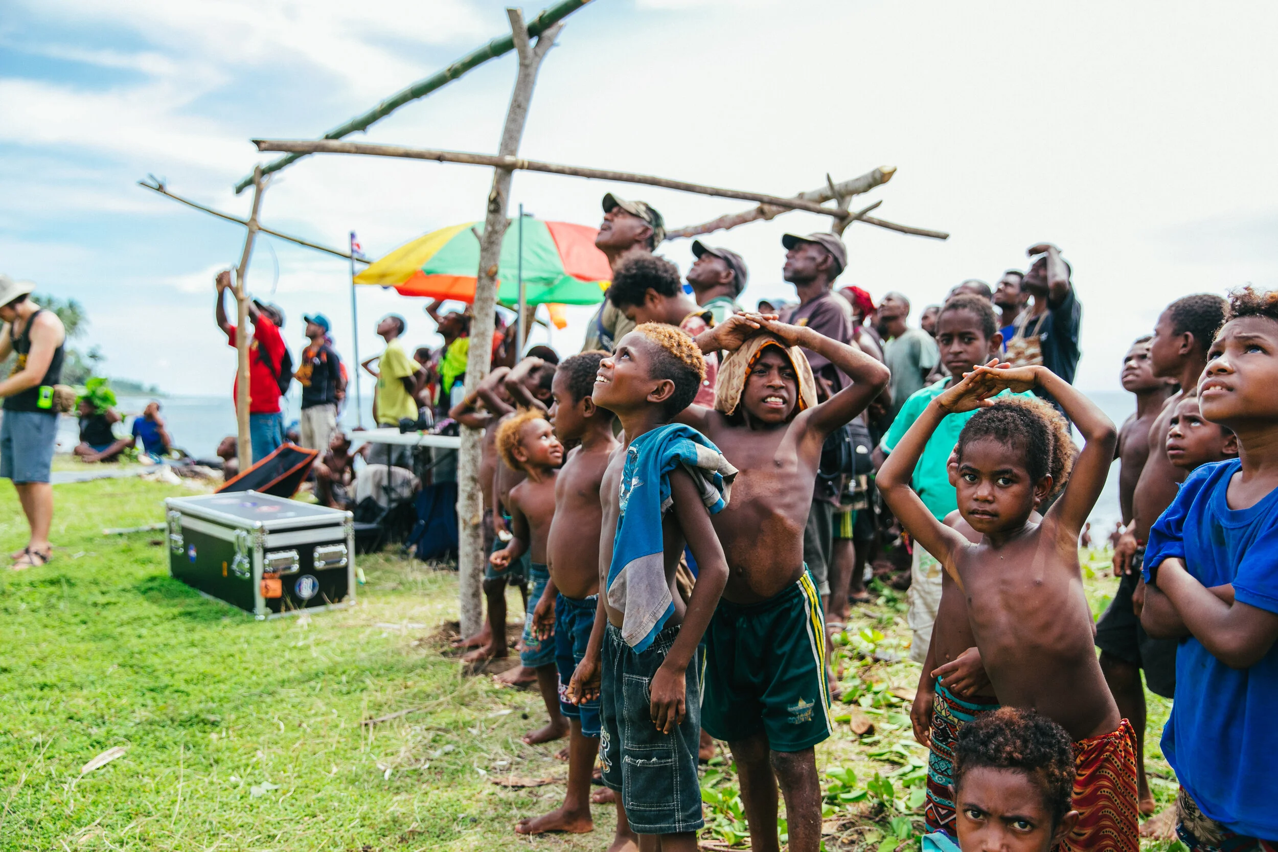 A young Manam boy watches the Pegasus VTAL (vertical take-off and landing) during vertical take off.