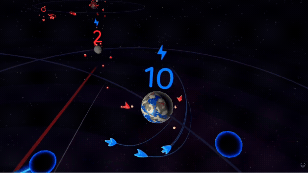 A player collects ships with their hand in the VR game, Gods of Gravity, and then sends them toward an enemy planet.