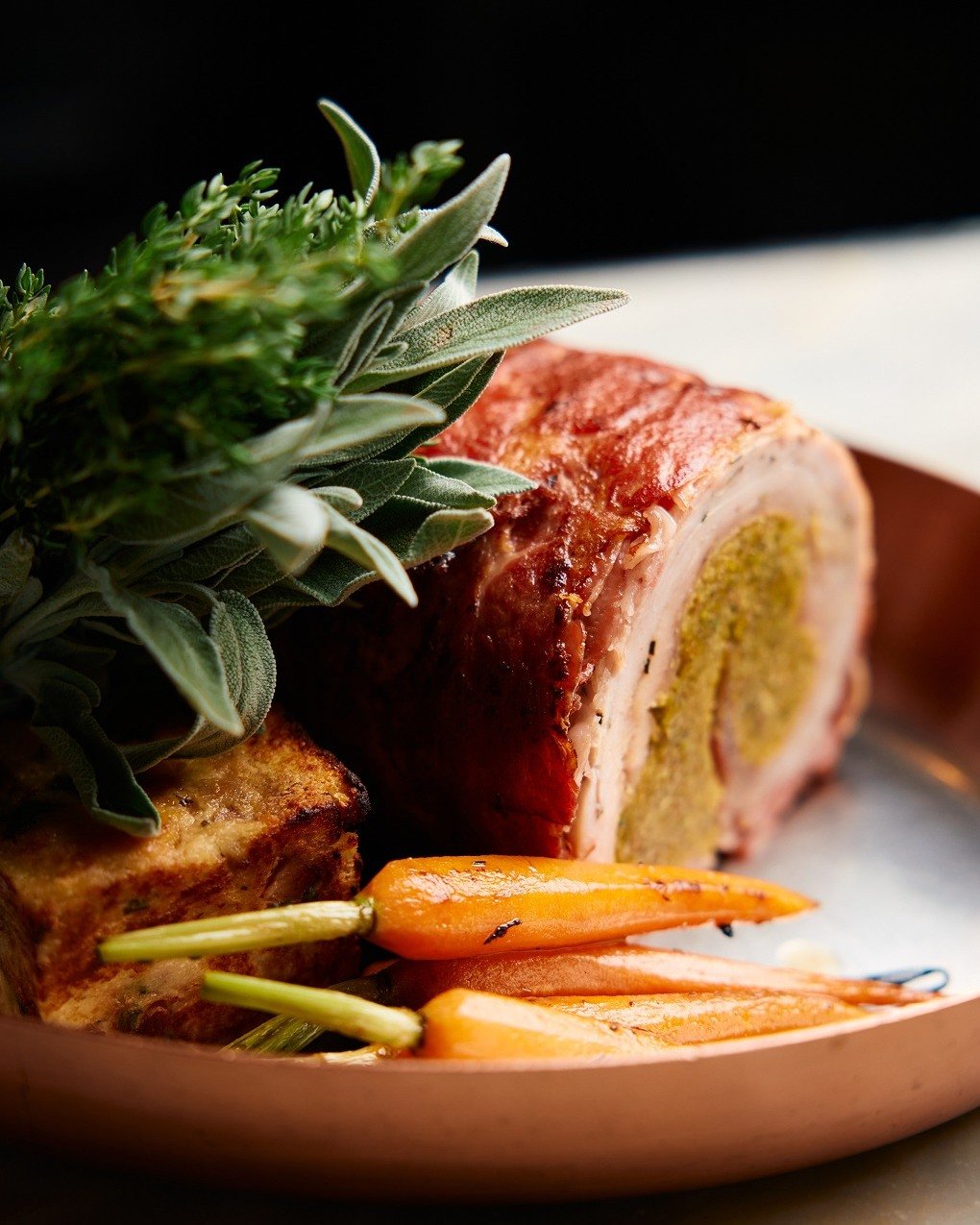 The turkey roulade &ndash; wrapped in bacon, stuffed with sage and apricot, served with seasonal delicacies. A holiday classic, reimagined. Join this season annd be sure to ask for our festive special menus.

 #TheMAINE #TheMAINEdxb #dubai #dxb #chri