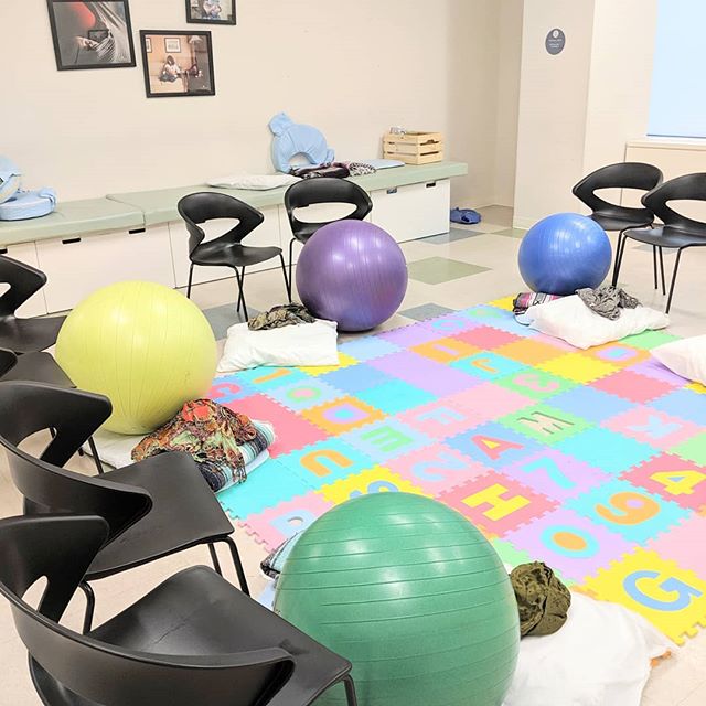 Learning how to use a birth ball during one of our childbirth classes