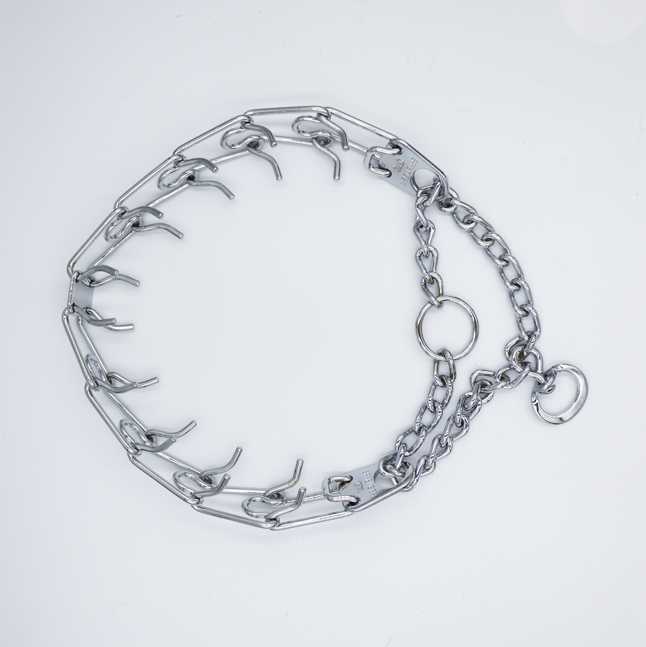 A silver chain collar with a combination of elongated oval links and larger circular links, set against a white background.