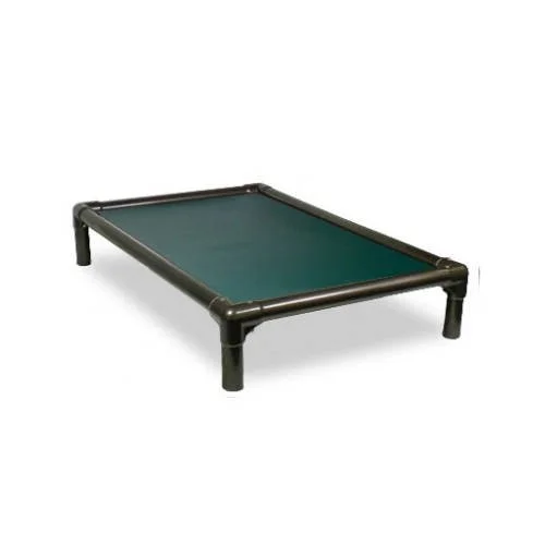 A dog bed used for training with a green playing surface and black frame.