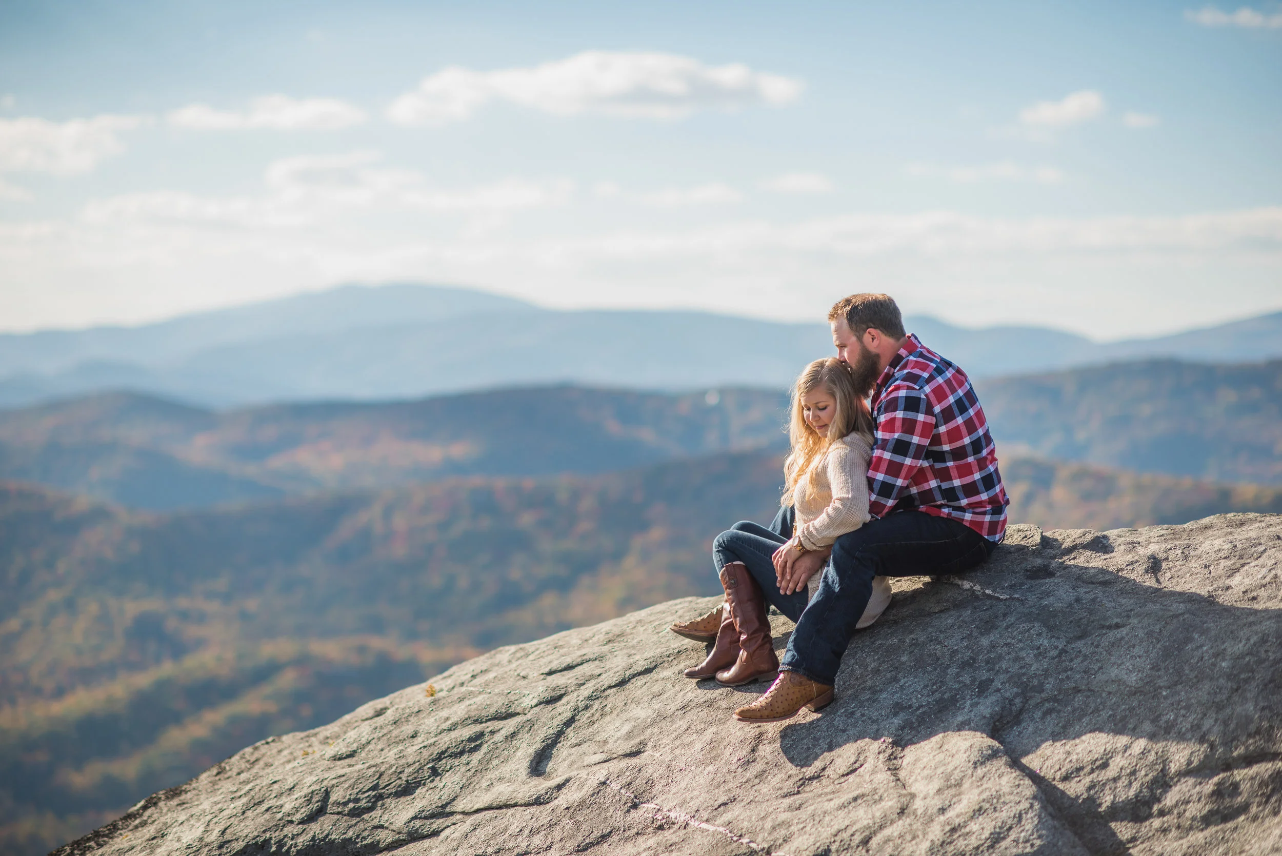 On the edge of a cliff inside Grandfather Mountain at the very beginning of an Engagement Session last Fall!