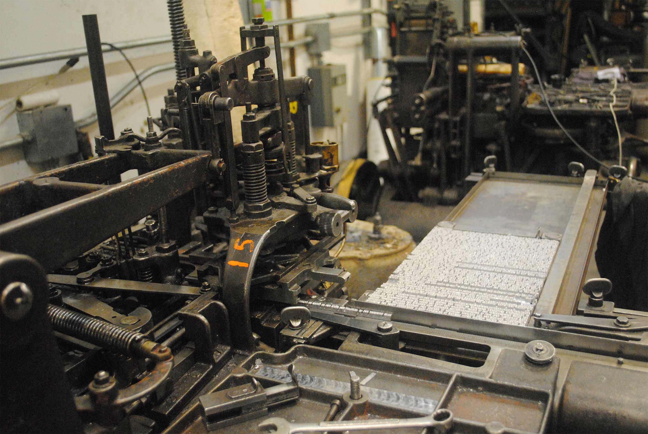 A galley of metal type on the Monotype caster