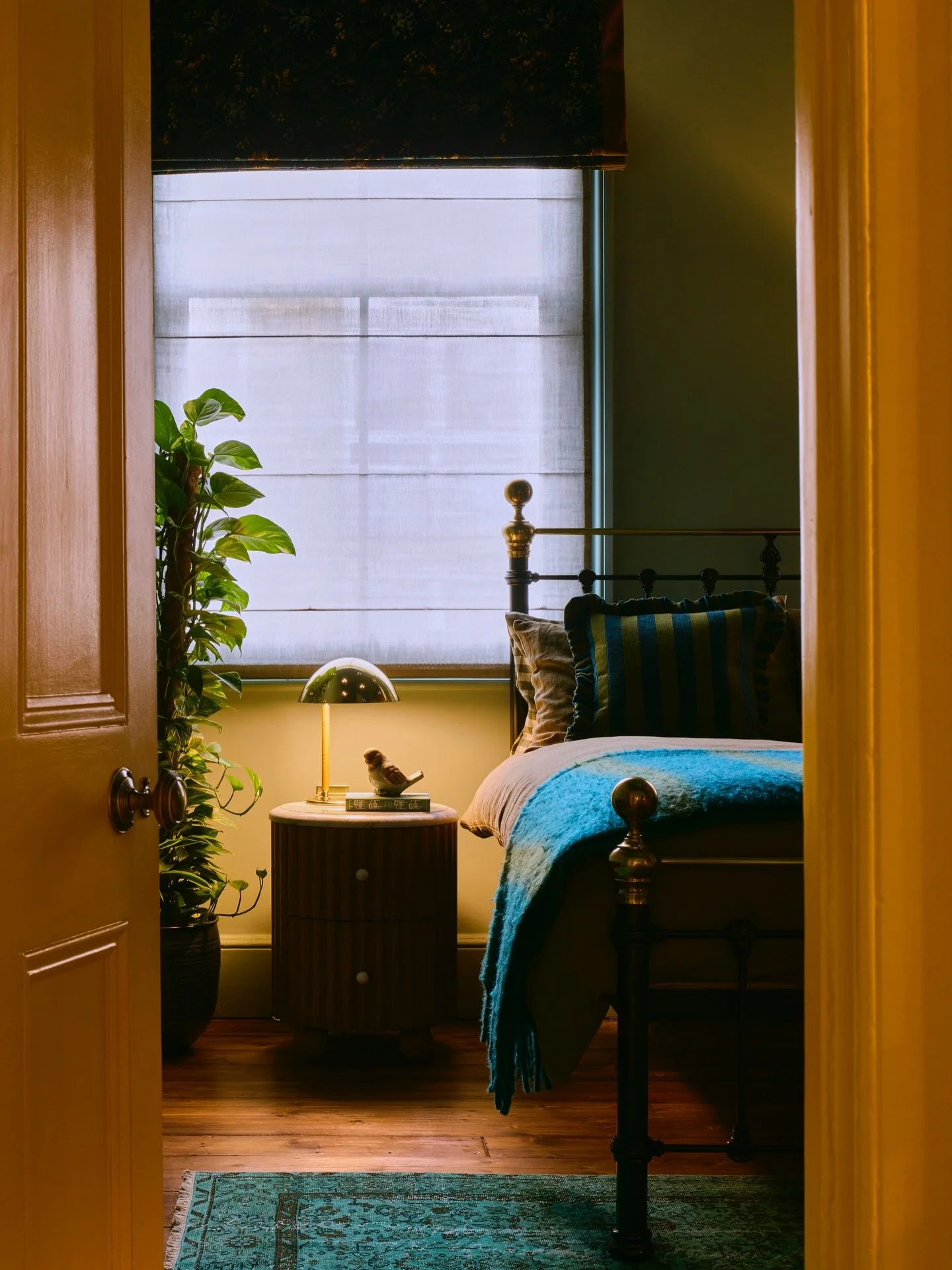 The Blue Guest Bedroom at &lsquo;The Duke&rsquo;

Wrapped in a pondy blue-green, this room leans straight into its own cosiness.

A metal-framed bed takes centre stage, grounded by restored original floorboards and a vintage turquoise rug from @floor