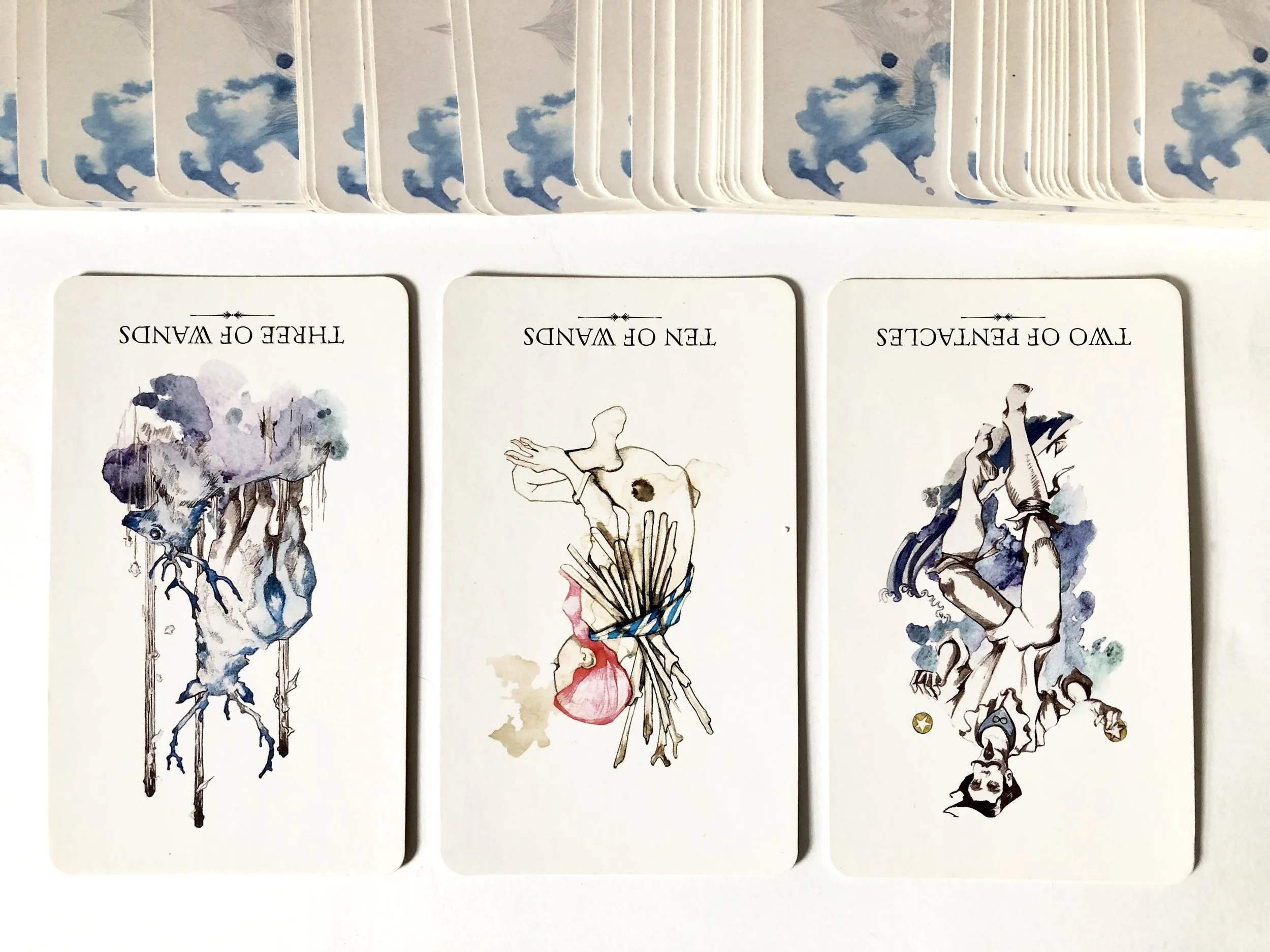 Ostara Tarot: Three of Wands rx, Ten of Wands rx, Two of Pentacles rx