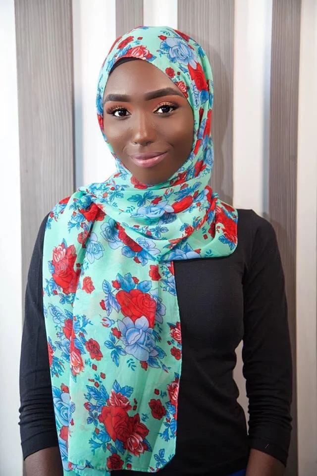 Model Maimuna Bah wearing a floral hijab from the new collection from ANIQ modesty.