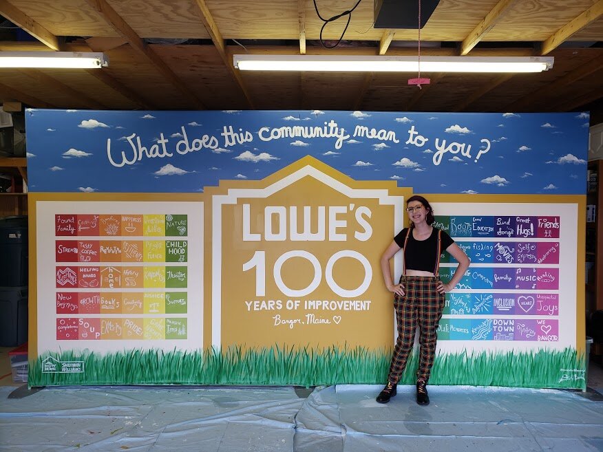 Sam with their Lowe's Centennial Mural