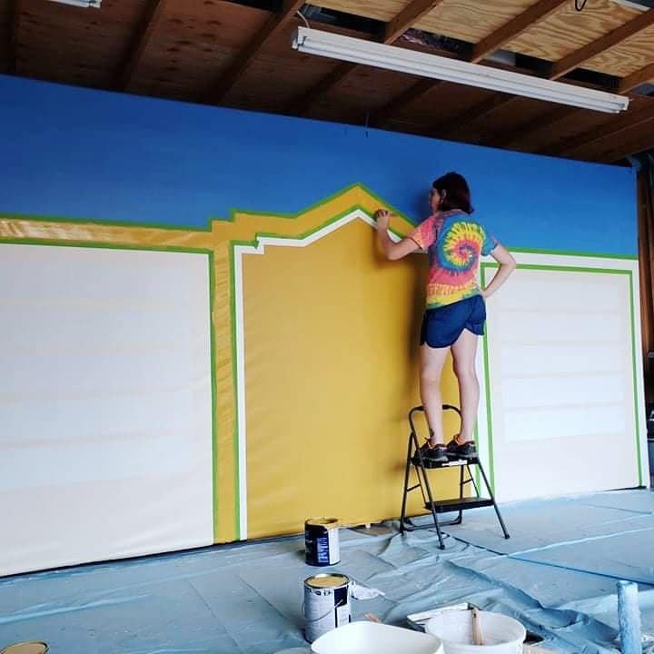 Sam paints her mural