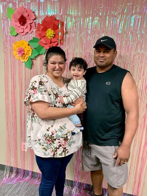 great pic Melissa Ruiz and family - little boy - got a crib from event.jpg