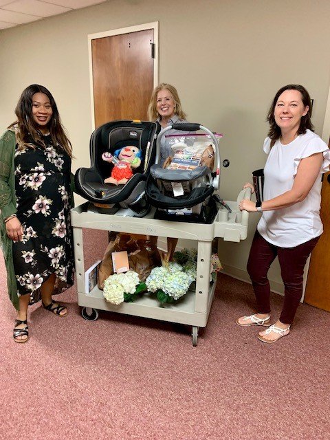 great pic mom Leshante sp and mentors Lisa Cascarella and Debra with cart of goodies.jpg