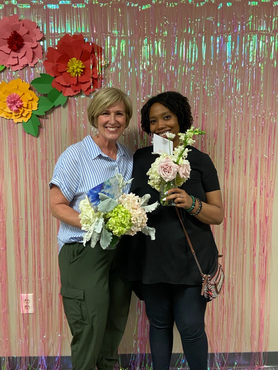 Kris Stewart mentor and Leah Tolbert mom (kwbc) with flowers pic 1.jpg