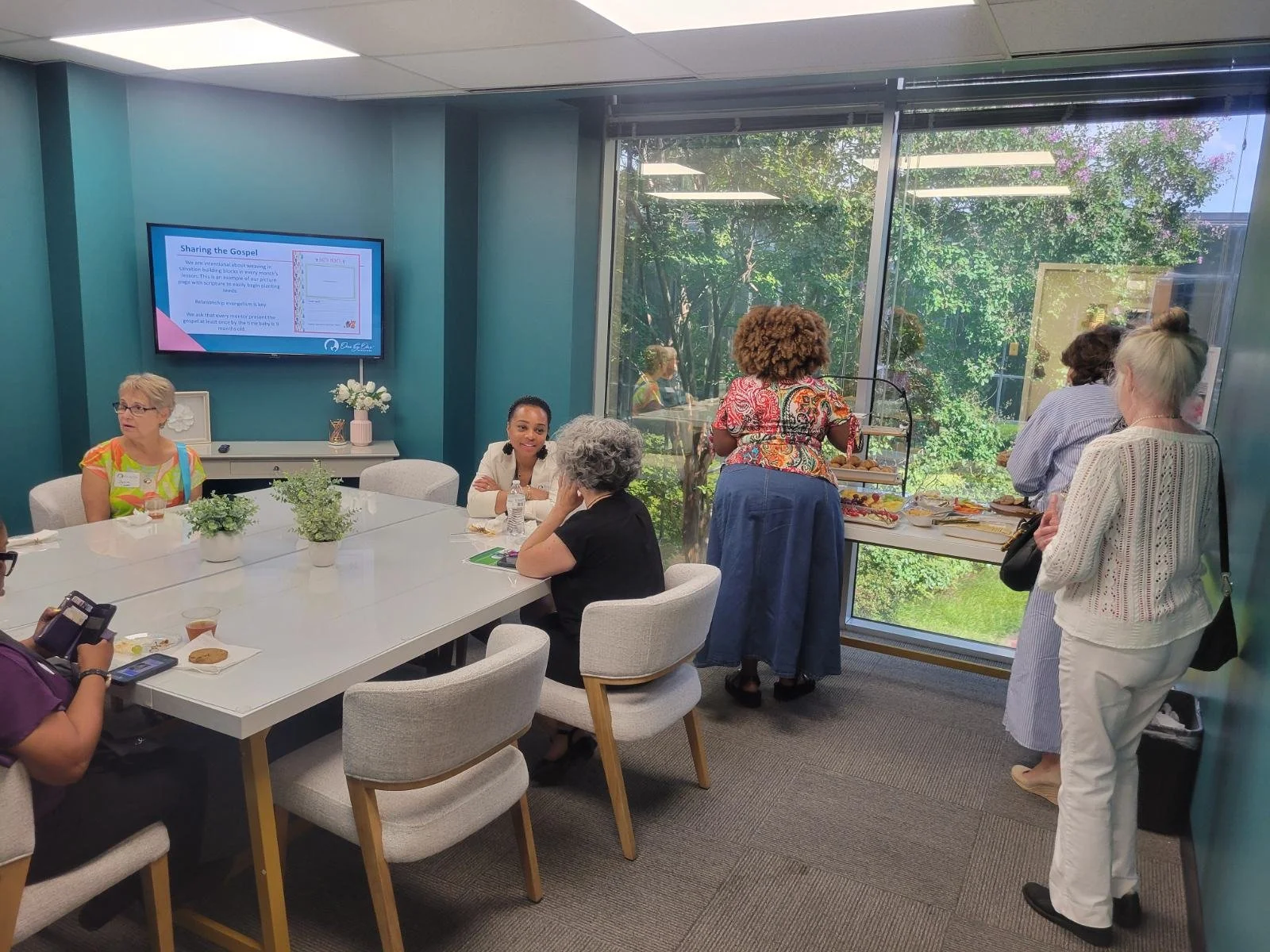 group in conference woom with refreshments.jpg