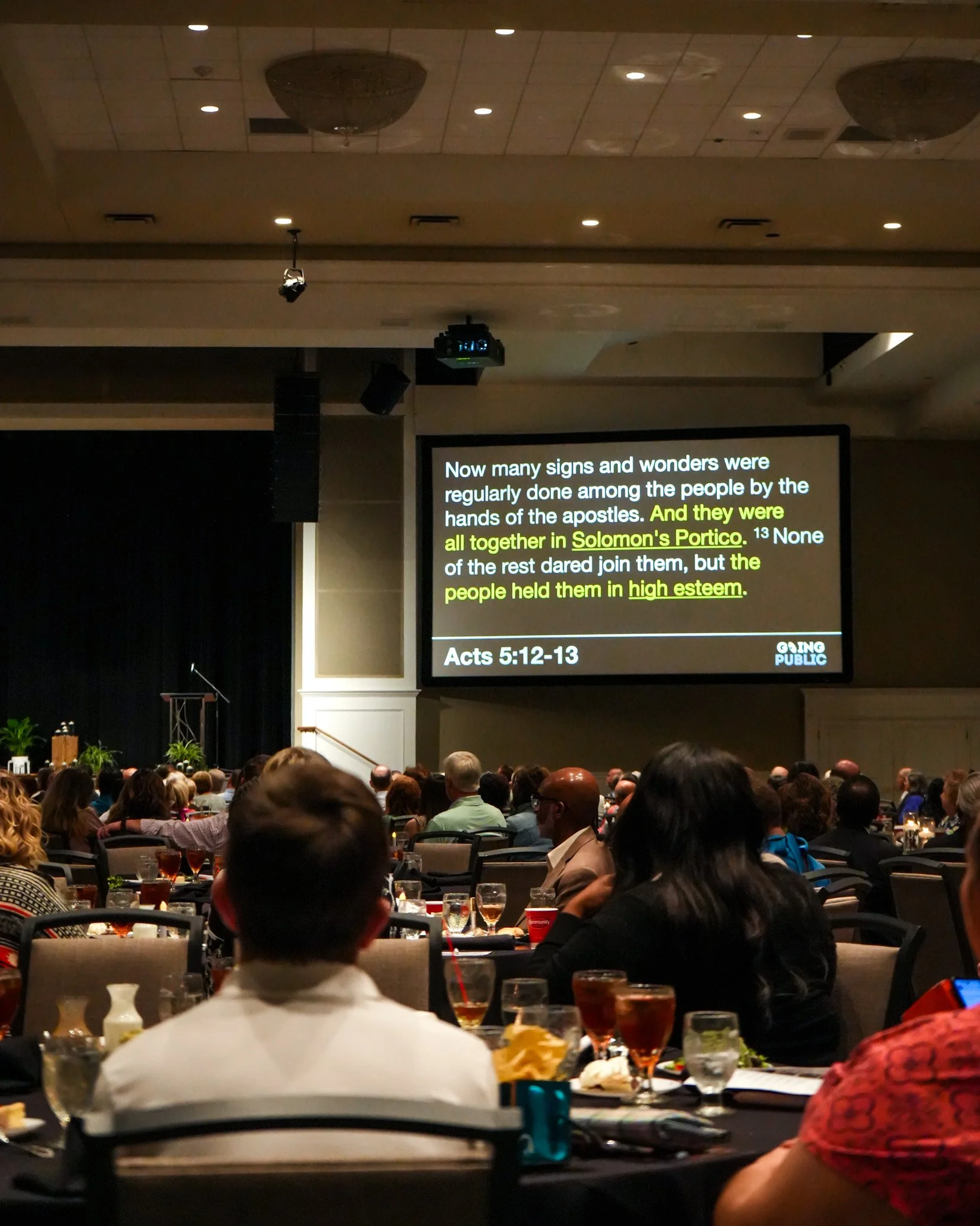 back of room with Bible verse slides.jpg