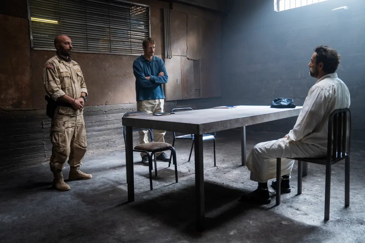 In-the-interrogation-room-with-John-Nixon-and-Saddam-Hussein.jpg.webp