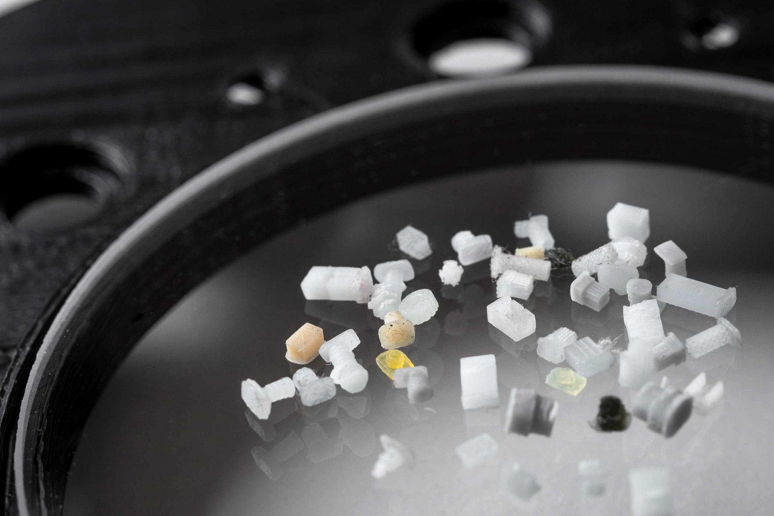 An array of 3D printed parts made in various materials including 3 grades of ABS, 3 different grades of PP, as well as ceramic loaded parts. Photo via Nanofabrica.