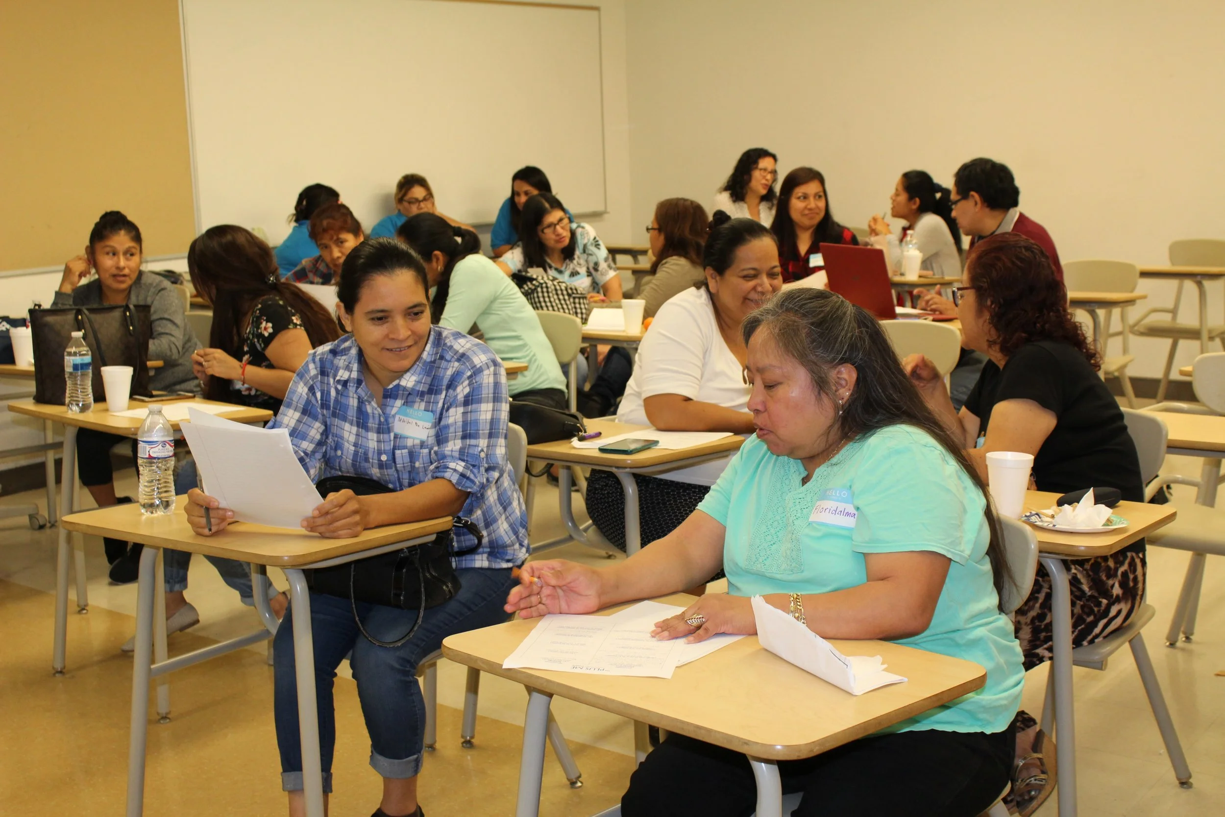 Parent smiling while sitting in a classroom