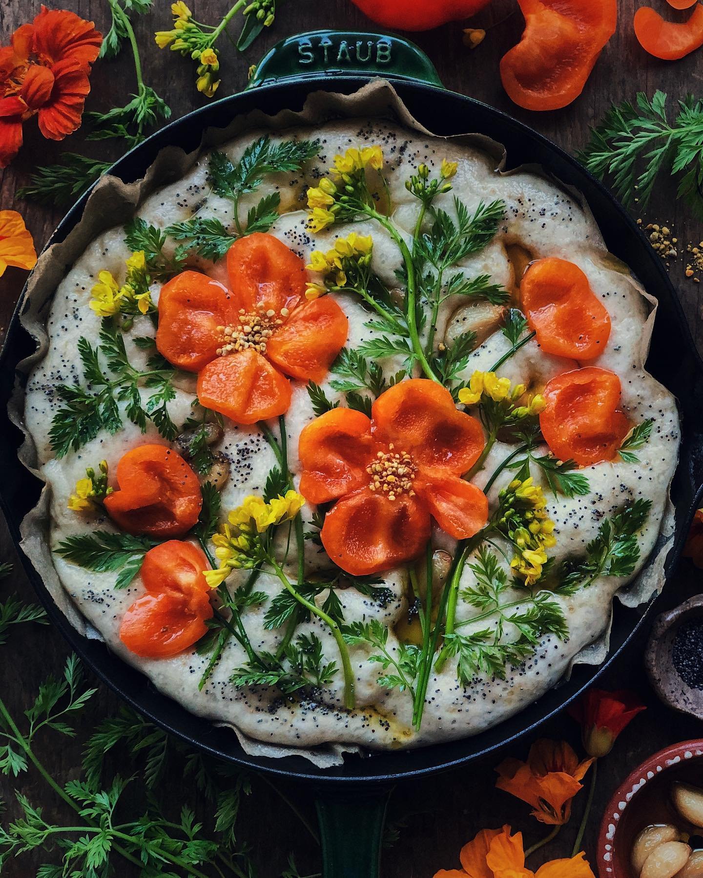 Garlic confit focaccia topped with orange bell peppers, carrot fronds, choy sum flowers, chives, and poppy seeds. ⁣
⁣
At this time of year, wild California poppies are popping up everywhere in the green spaces in my neighborhood. I am always tempted 