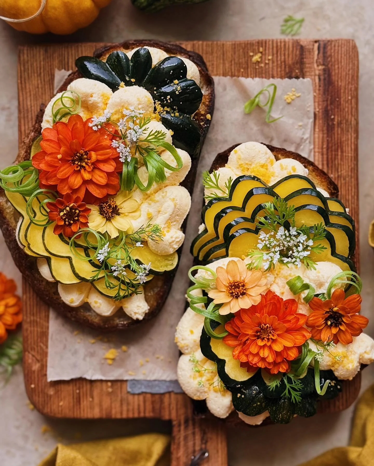 I made one of my favorite Chinese restaurant dishes as a toast! These are pan-fried sourdough slices topped with salted egg yolk whipped ricotta and roasted acorn squash, then garnished with scallion curlies, cilantro blossoms, zinnias from my garden
