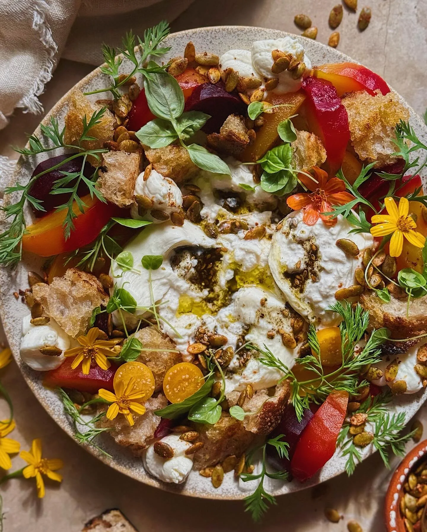 Injecting a little bit of autumnal sunshine into your feed with this burrata and roasted beet kitchen cleanout plate. In the middle is truffle burrata with a drizzle of za&rsquo;atar oil surrounded by a wreath of roasted beets, chunky croutons, golde