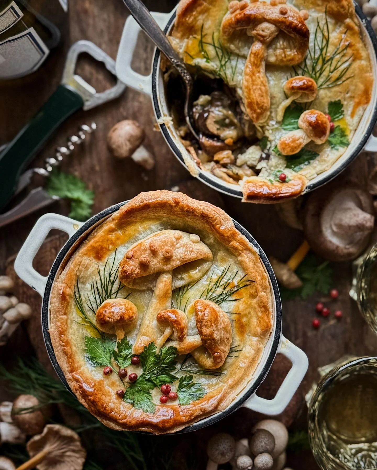 Mini pot pies filled with a silky stew of mushrooms, caramelized onions, cream, and a @california.wines Chardonnay, tucked under a flaky pastry crust decorated with pastry mushrooms, dill, parsley, and pink peppercorns. [AD]⁣
⁣
These pot pies are loa